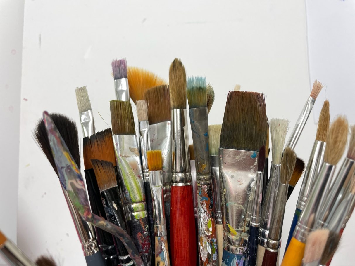 Close-up of artist brushes in the studio